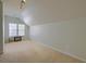 Upstairs Bonus Room featuring an angled ceiling, neutral paint and carpet at 9682 Pebble Creek Blvd, Summerville, SC 29485