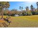 Community park with benches and a water fountain in the background, perfect for relaxation and outdoor activities at 9682 Pebble Creek Blvd, Summerville, SC 29485
