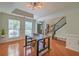 Dining room with hardwood floors, table with seating, and natural light at 9682 Pebble Creek Blvd, Summerville, SC 29485