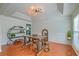 Elegant dining room featuring wood floors, industrial chandelier and seating for four at 9682 Pebble Creek Blvd, Summerville, SC 29485