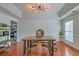 Elegant dining room with industrial chandelier and table seating for four at 9682 Pebble Creek Blvd, Summerville, SC 29485