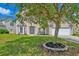 Charming home exterior with a well-manicured lawn and front garden, complete with a welcoming entrance at 9682 Pebble Creek Blvd, Summerville, SC 29485
