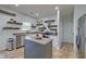 Well-lit kitchen with stainless steel appliances, kitchen island, and lots of storage space at 9682 Pebble Creek Blvd, Summerville, SC 29485