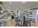 Bright, modern kitchen with stainless steel appliances, kitchen island, and stylish open shelving at 9682 Pebble Creek Blvd, Summerville, SC 29485