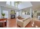 Large living room with fireplace, hardwood floors, and plenty of natural light at 9682 Pebble Creek Blvd, Summerville, SC 29485