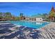 Inviting community pool area featuring clear blue water, shaded seating, and well-maintained landscaping at 9682 Pebble Creek Blvd, Summerville, SC 29485