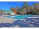 Beautiful community pool with a covered seating area, providing a perfect spot for relaxation and recreation at 9682 Pebble Creek Blvd, Summerville, SC 29485