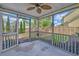 Enjoy outdoor living in this screened porch overlooking the backyard and landscaping at 9682 Pebble Creek Blvd, Summerville, SC 29485