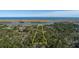 Picture of a treed lot, with water in the background, with the property lines highlighted at 0 Doar Rd, Awendaw, SC 29429