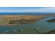 Aerial view showcasing the serene coastline, marshes, and private docks, offering a tranquil waterfront lifestyle at 0 Doar Rd, Awendaw, SC 29429