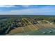 Stunning aerial view highlighting the property lines of a lush, waterfront lot with mature trees and dock access at 0 Doar Rd, Awendaw, SC 29429