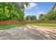 Spacious backyard features a concrete patio and a high wooden fence providing ample privacy at 1 Bossis Dr, Charleston, SC 29407