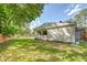 Expansive backyard with a wooden fence, lush green grass, and ample space for outdoor activities at 1 Bossis Dr, Charleston, SC 29407