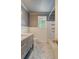This modern bathroom has geometric tile floors, a gray vanity, and a gray accent wall at 1 Bossis Dr, Charleston, SC 29407