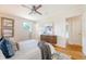 Well-lit bedroom features a ceiling fan, stylish decor, and hardwood floors at 1 Bossis Dr, Charleston, SC 29407