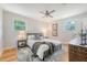 Cozy bedroom with ceiling fan, side tables with lamps, and a stylish area rug at 1 Bossis Dr, Charleston, SC 29407