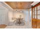Charming breakfast nook with custom bench seating, wood ceiling, and hexagonal tile flooring at 1 Bossis Dr, Charleston, SC 29407