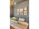 Close-up of dining room décor and gray accent wall with decorative gold frames at 1 Bossis Dr, Charleston, SC 29407