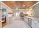Spacious kitchen showcasing cabinetry, tile backsplash, and wood-planked ceiling at 1 Bossis Dr, Charleston, SC 29407