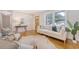 Elegant living room with hardwood floors and white wainscotting, open to a hallway at 1 Bossis Dr, Charleston, SC 29407
