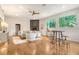 Bright living room with hardwood floors, fireplace, and ample natural light from large windows at 1 Bossis Dr, Charleston, SC 29407
