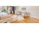Elegant living room with hardwood floors, wainscotting, and an open view into the dining room at 1 Bossis Dr, Charleston, SC 29407
