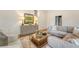 Inviting living room featuring a comfortable sectional, accent chairs, and decorative cabinet at 1 Bossis Dr, Charleston, SC 29407
