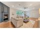 Open-concept living room with hardwood floors, fireplace, and stylish furniture arrangement at 1 Bossis Dr, Charleston, SC 29407