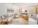 Elegant living room with hardwood floors and white wainscotting, open to a hallway at 1 Bossis Dr, Charleston, SC 29407