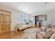 Bright living room with hardwood floors and white wainscotting, open to a dining area and exterior view at 1 Bossis Dr, Charleston, SC 29407