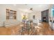 Stylish living room with hardwood floors, fireplace, bar table, and staircase leading to another room at 1 Bossis Dr, Charleston, SC 29407
