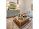 Living room featuring stylish console table, glass coffee table, and view into adjacent dining nook at 1 Bossis Dr, Charleston, SC 29407