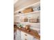 Close up of pantry shelving with woven baskets and decorative copper accents at 1 Bossis Dr, Charleston, SC 29407