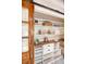 Detailed view of pantry shelving with wooden countertop and decor at 1 Bossis Dr, Charleston, SC 29407