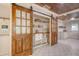 Pantry with sliding glass doors and custom shelving for ample storage at 1 Bossis Dr, Charleston, SC 29407
