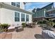 Backyard with a brick patio, lounge furniture, and a view of the home's exterior at 1003 Jervey Point Rd, Wando, SC 29492