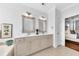 Bathroom with neutral colored cabinetry, tiled floors and dual sinks at 1003 Jervey Point Rd, Wando, SC 29492