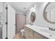Bright bathroom with dual sinks, tile floors, framed mirrors, and neutral paint for a clean, modern look at 1003 Jervey Point Rd, Wando, SC 29492