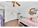 Bright bedroom with a charming decor and a ceiling fan above the bed at 1003 Jervey Point Rd, Wando, SC 29492