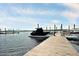 Boat dock featuring covered boats in their slips with clear skies at 1003 Jervey Point Rd, Wando, SC 29492
