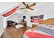 Bonus room with a bed, chair, desk, and sports decor, lit by a ceiling fan at 1003 Jervey Point Rd, Wando, SC 29492