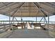 Covered gazebo features benches with water views and a boat dock at 1003 Jervey Point Rd, Wando, SC 29492