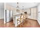 Eat-in kitchen features granite countertops, stainless steel appliances, and classic white cabinetry at 1003 Jervey Point Rd, Wando, SC 29492