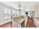 Eat-in kitchen featuring granite countertops, stainless steel appliances, with view to adjacent living room at 1003 Jervey Point Rd, Wando, SC 29492