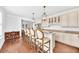Eat-in kitchen with granite countertops, stainless steel appliances, and view of adjacent sitting area at 1003 Jervey Point Rd, Wando, SC 29492