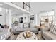Bright, open living room featuring a soaring ceiling and coastal-inspired decor with light color palette at 1003 Jervey Point Rd, Wando, SC 29492