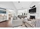 Inviting living room boasts a fireplace, hardwood floors, and coastal decor throughout, enhancing the ambiance at 1003 Jervey Point Rd, Wando, SC 29492
