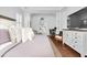 Bright main bedroom with vaulted ceilings, shuttered windows, hardwood floors and desk at 1003 Jervey Point Rd, Wando, SC 29492