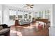 Sunroom with walls of windows overlooking water view, hardwood flooring, and ample natural light at 1003 Jervey Point Rd, Wando, SC 29492