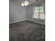 Cozy bedroom with plush carpeting, ceiling fan, and a bright window with sheer curtains at 103 Dupont Way, Summerville, SC 29485